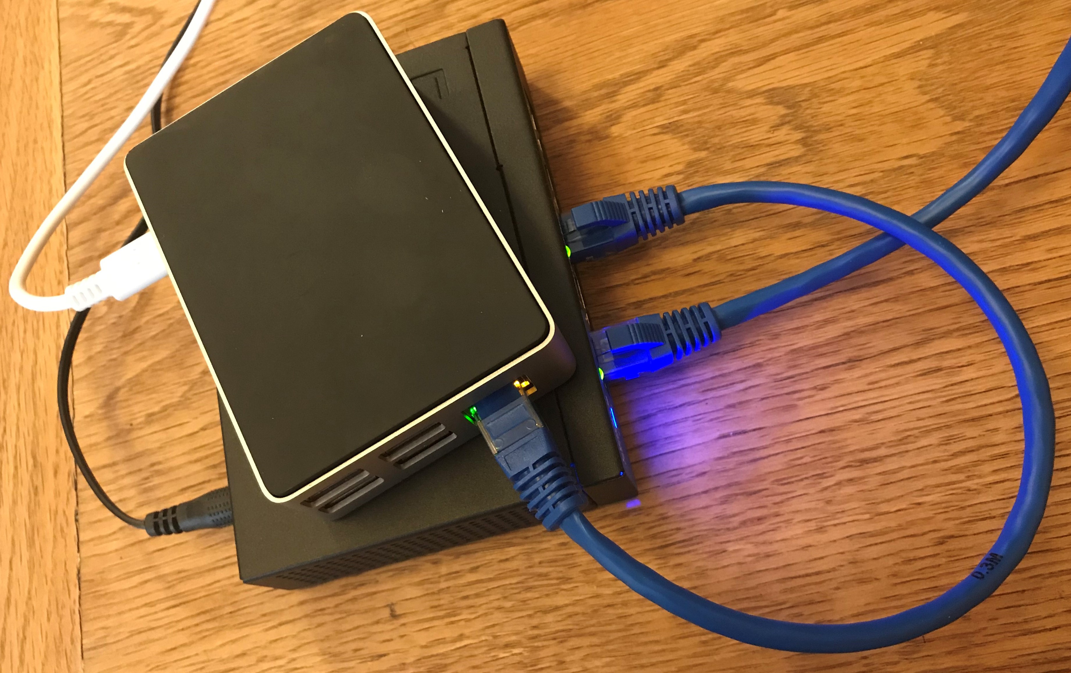 Figure 1: An encased Raspberry Pi 4 connected to a network switch